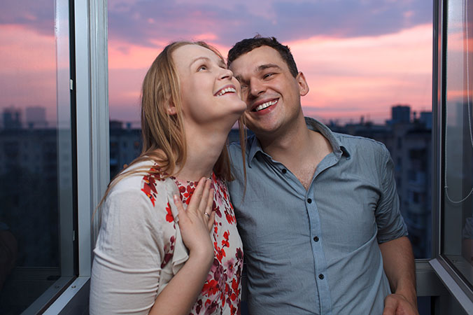 happy couple on the balcony